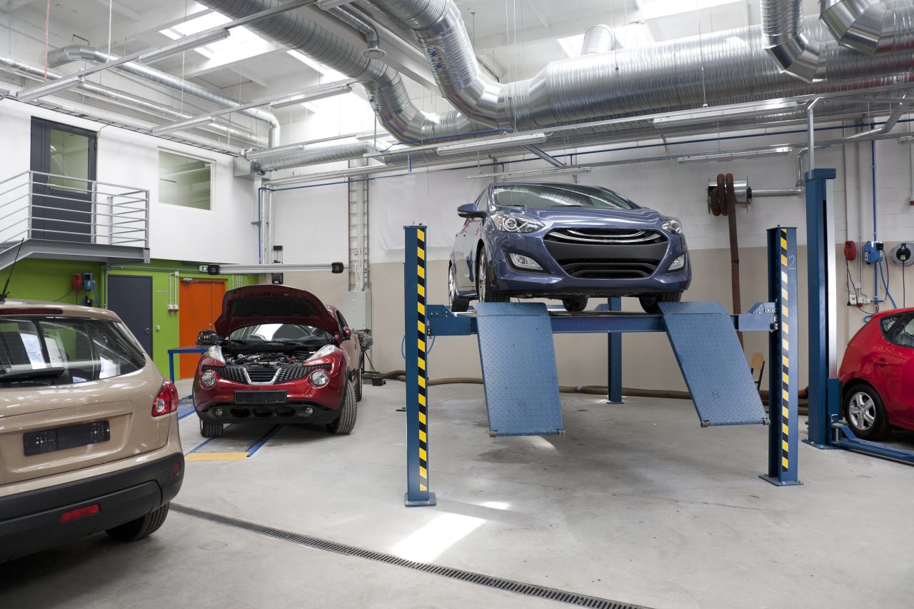 Plaque W garage et assurance professionnelle